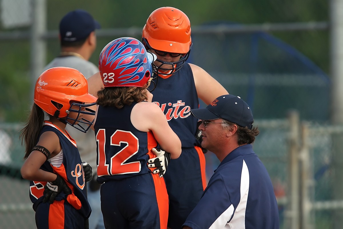 Softball players at local Little Leagues don pro league's team names,  jerseys